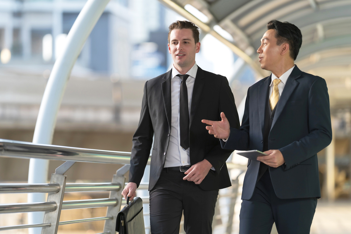 Business People Walking and Talk to Each Other